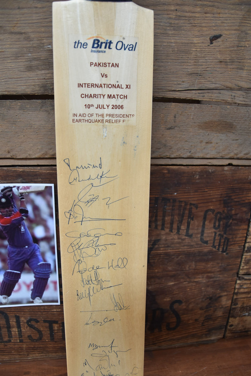 Load image into Gallery viewer, International XI v Pakistan Bat Personally Signed by both Teams, 2006
