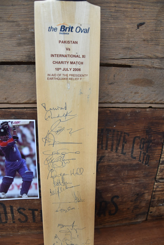 International XI v Pakistan Bat Personally Signed by both Teams, 2006
