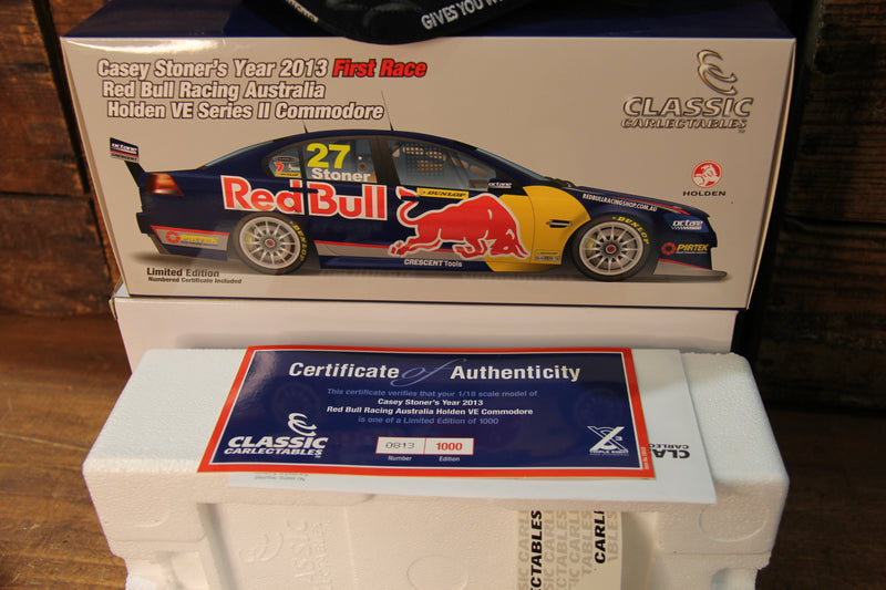 Load image into Gallery viewer, Casey Stoner Personally Signed 1:18 Holden VE Commodore + Signed Red Bull Cap
