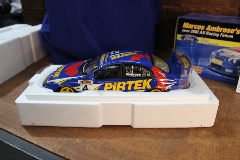 Load image into Gallery viewer, Marcos Ambrose Personally Signed Official Shirt + 2002 AU Falcon 1:18
