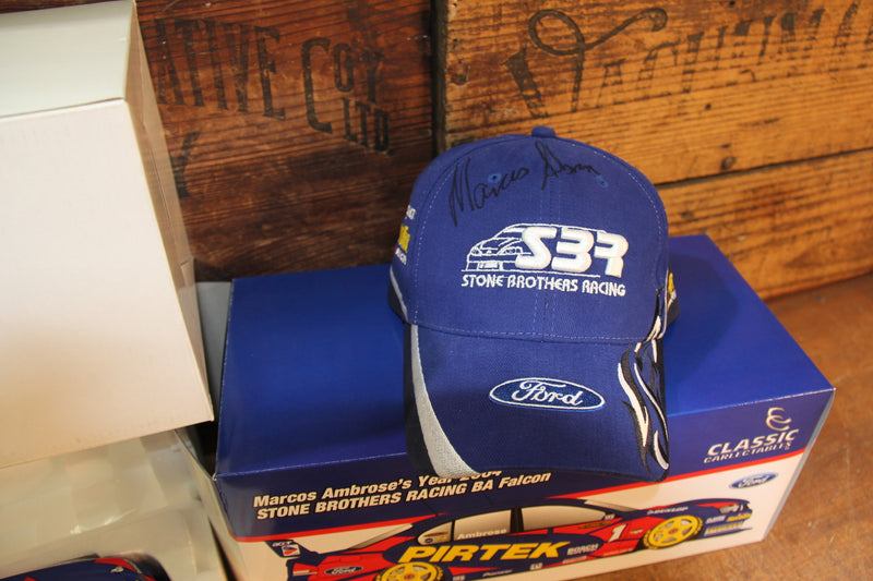 Load image into Gallery viewer, Marcos Ambrose Personally Signed Official 2004 Cap + 2004 BA Falcon 1:18
