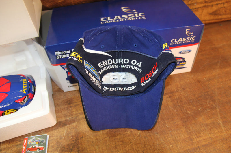 Load image into Gallery viewer, Marcos Ambrose Personally Signed Official 2004 Cap + 2004 BA Falcon 1:18
