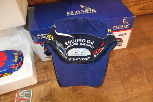 Marcos Ambrose Personally Signed Official 2004 Cap + 2004 BA Falcon 1:18